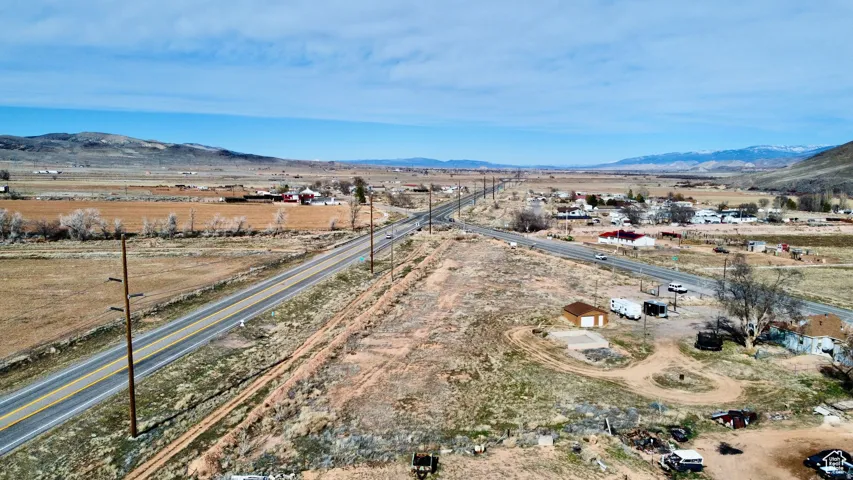 Aerial view of sparsely populated area with a mountain backdrop