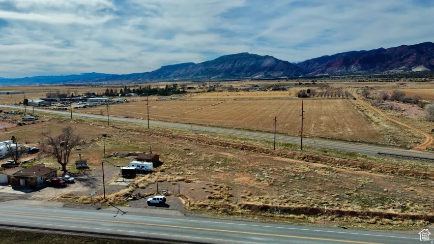 Aerial view of sparsely populated area with a mountain backdrop