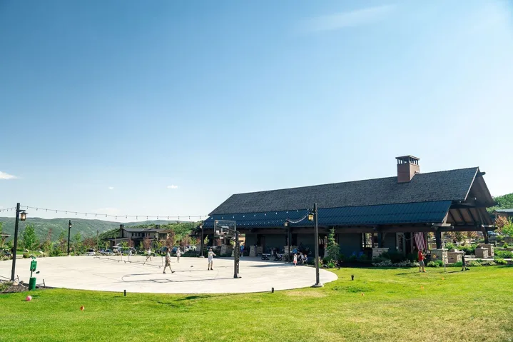 View of home's community featuring a patio area and community basketball court