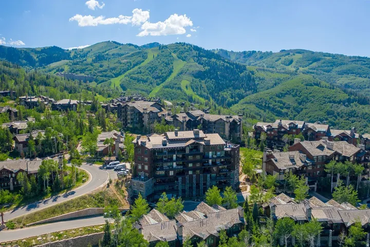 Aerial view of residential area featuring a mountain backdrop