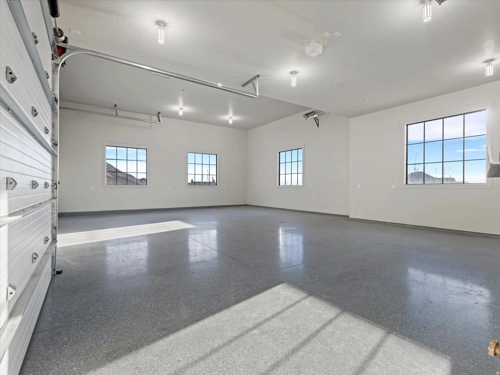 Half of the garage with baseboards