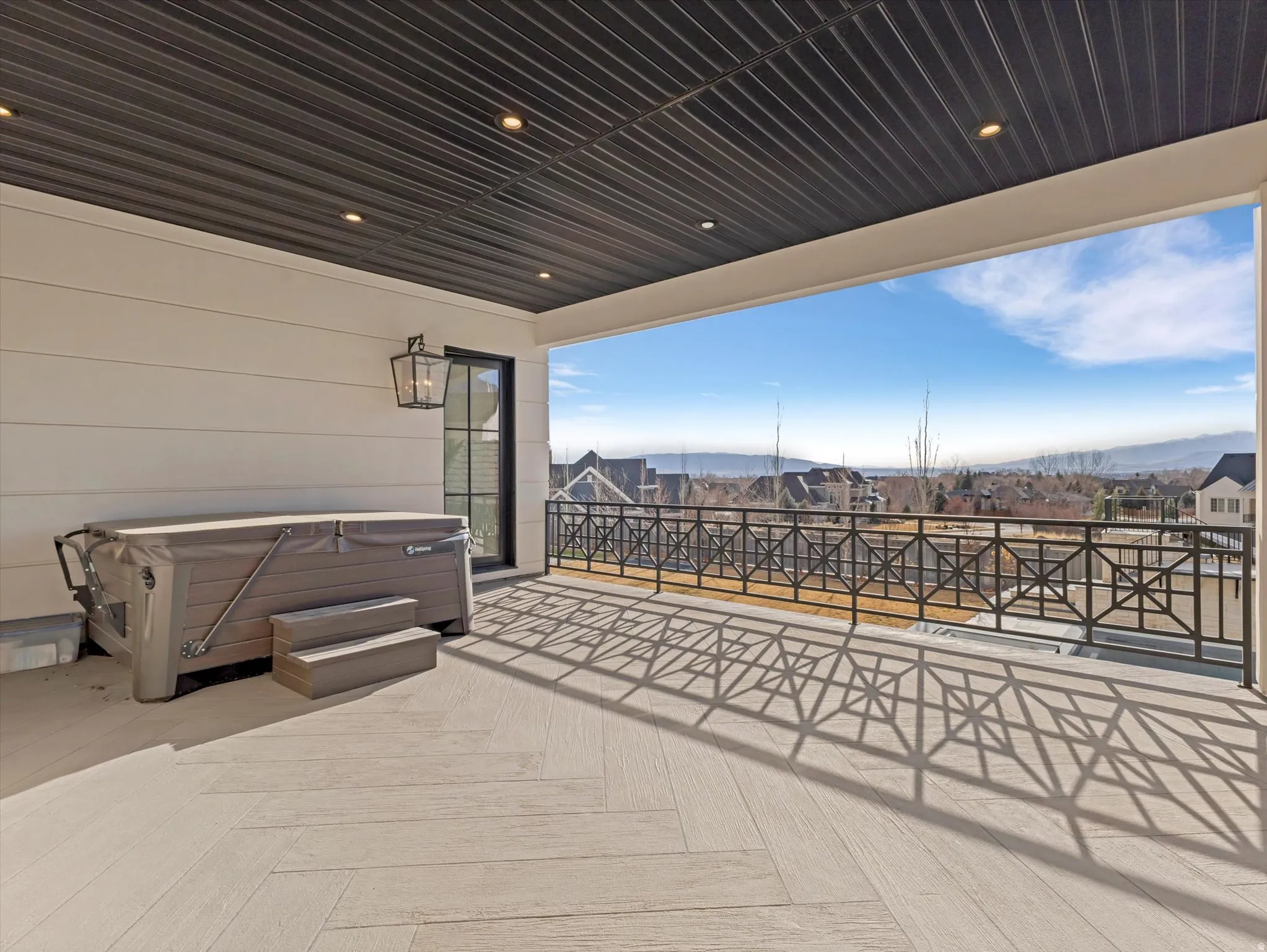 Primary bedroom private patio with a hot tub and Sunset/valley viewsview