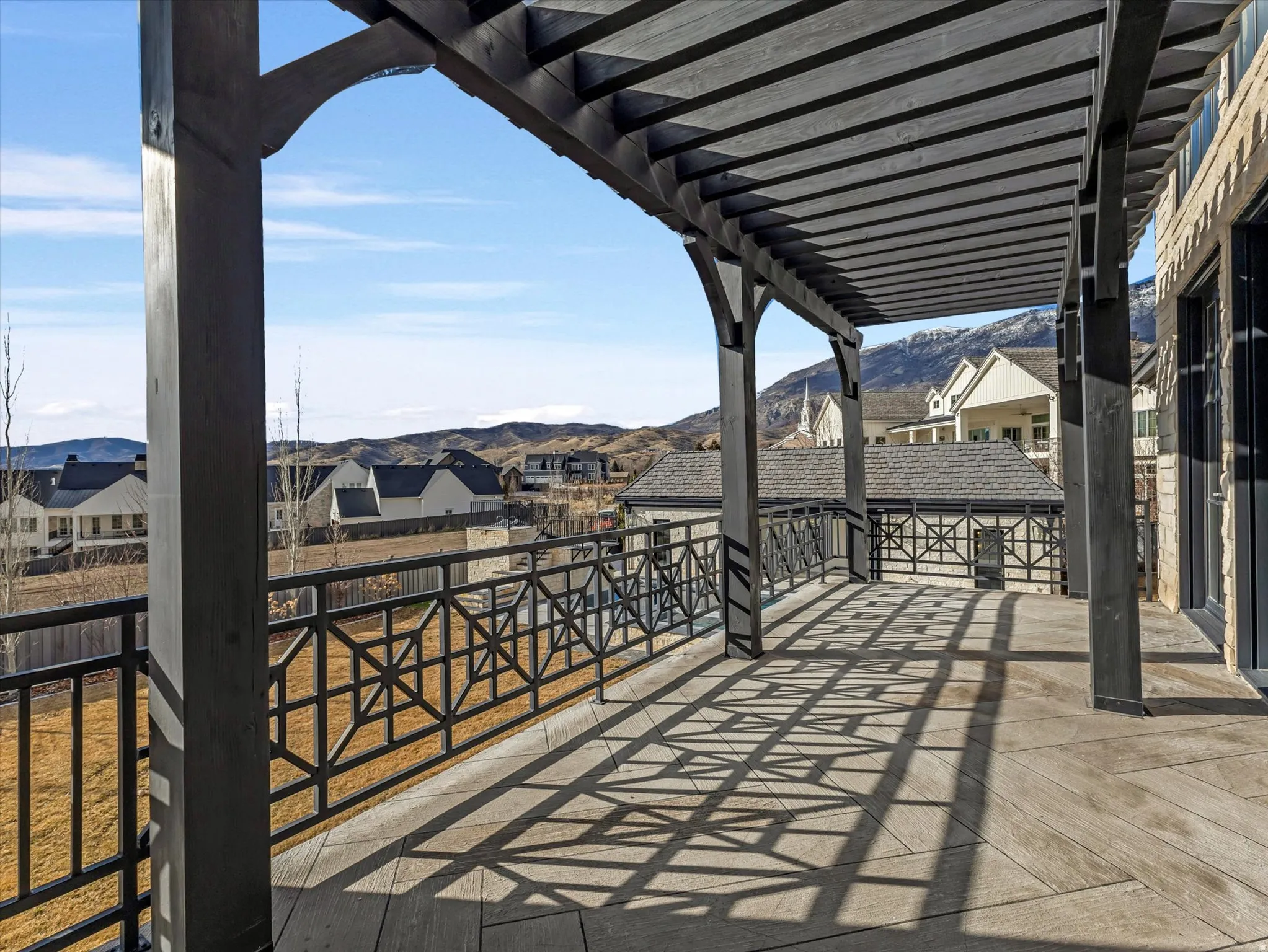 Kitchen walkout deck featuring a residential view and a mountain view