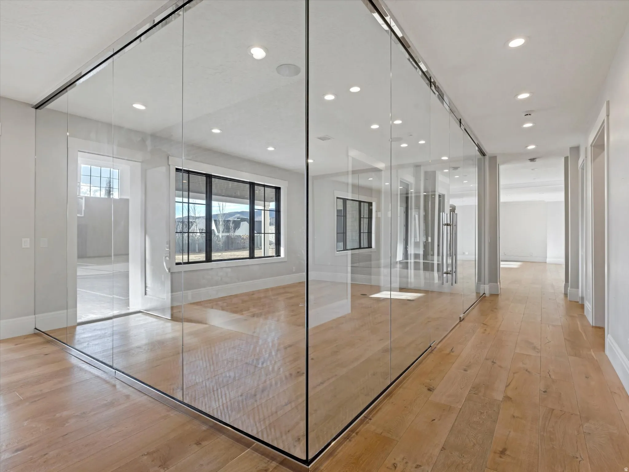 Fitness/dance space featuring light wood-style floors