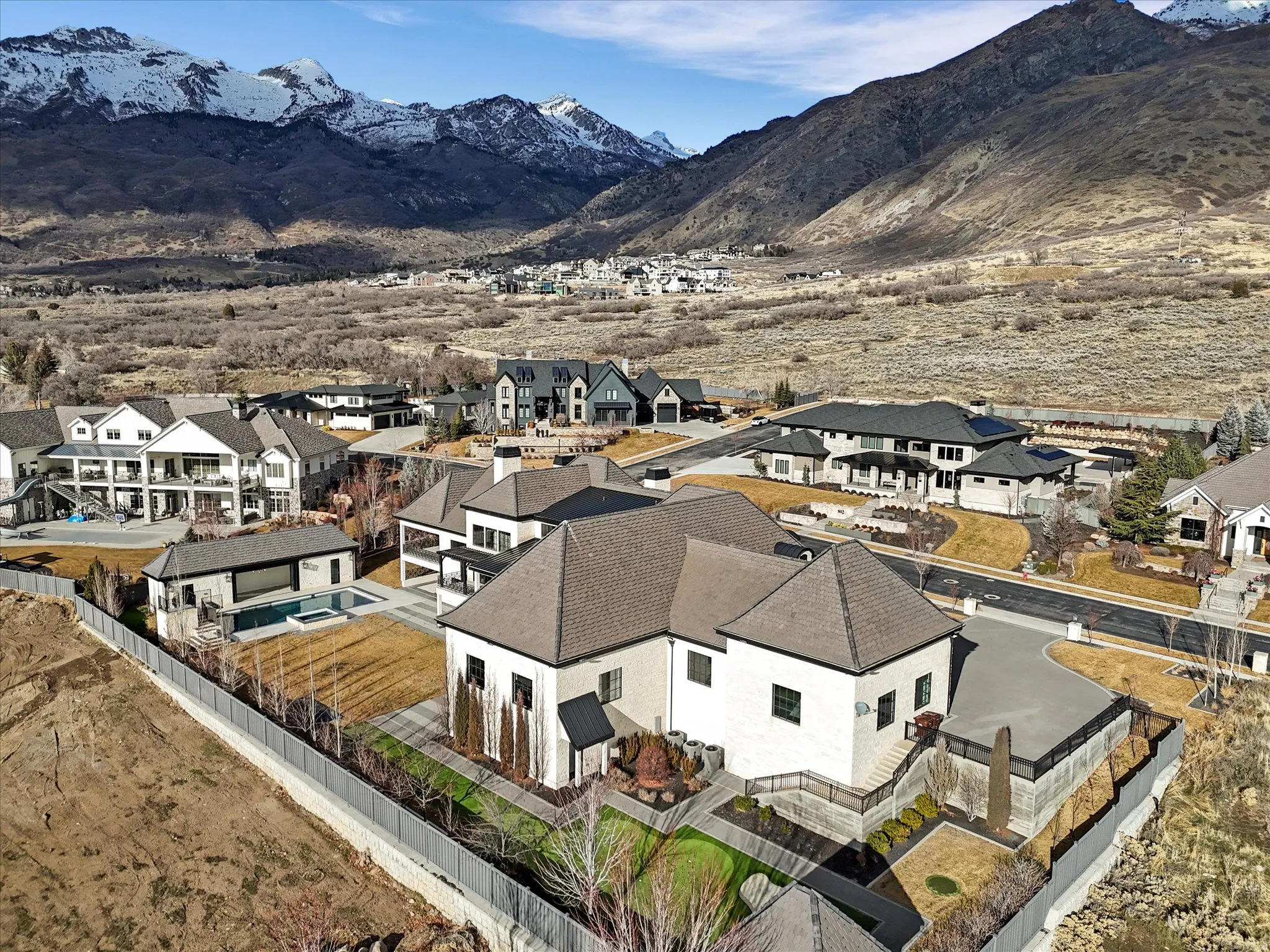Aerial view of residential area featuring a mountain backdrop
