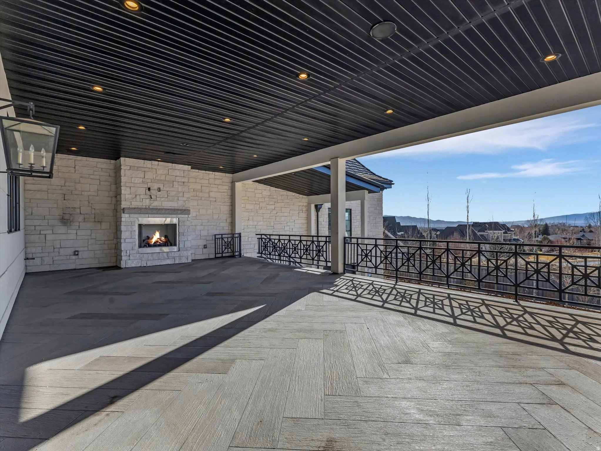 Kitchen walkout patio / terrace featuring a fireplace and a mountain view