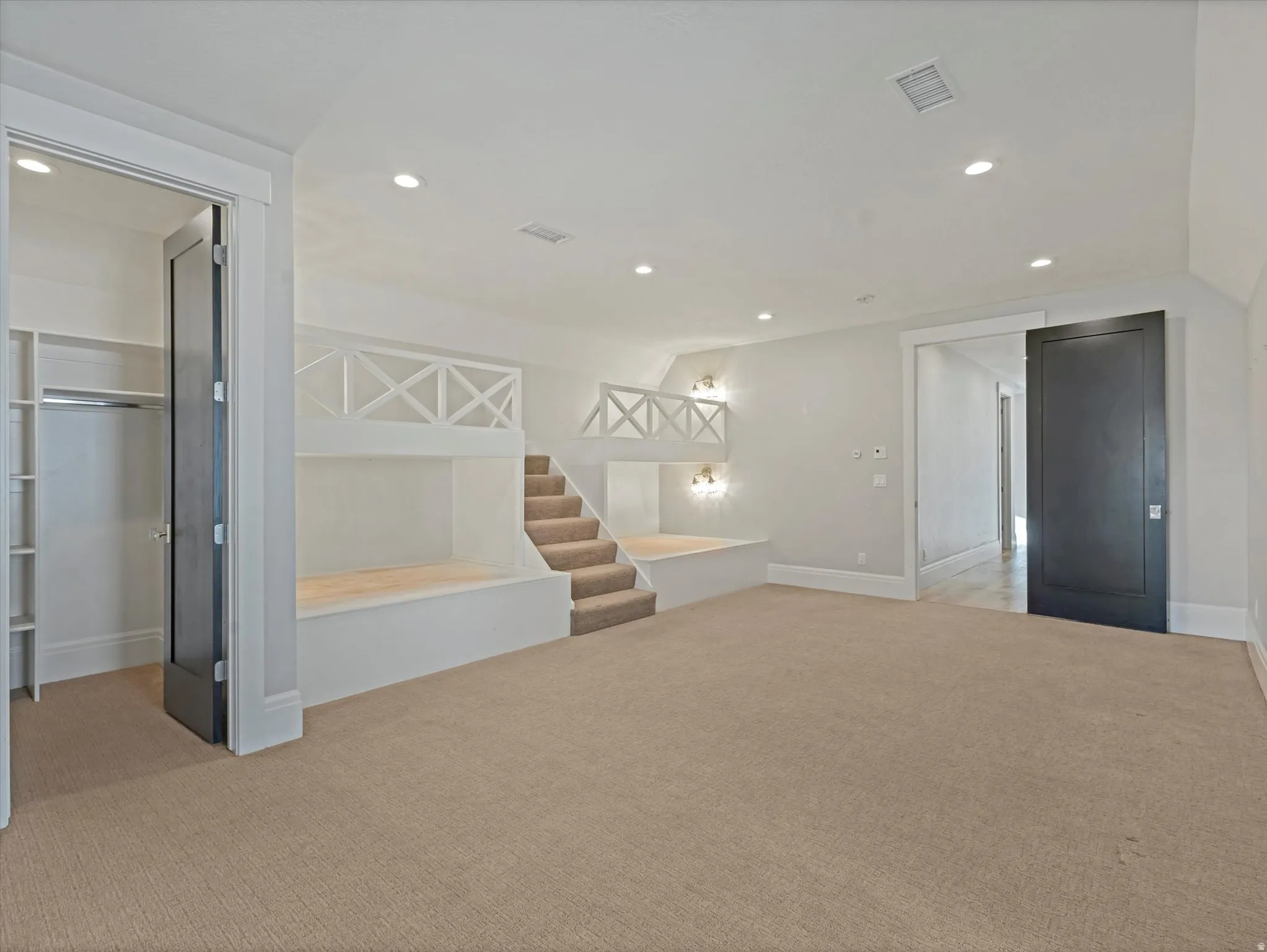 Bedroom featuring light carpet and recessed lighting