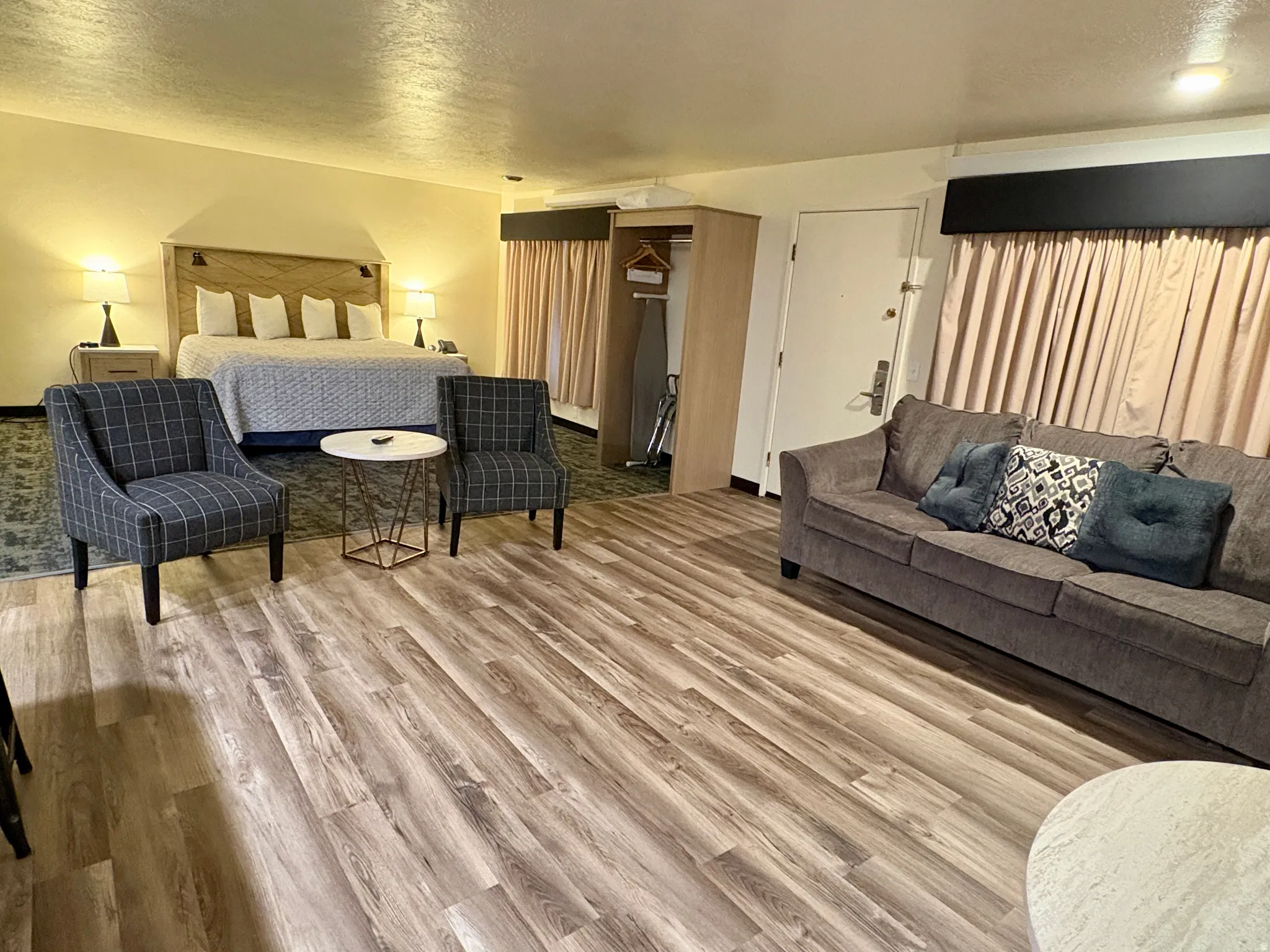 Bedroom with a textured ceiling and light wood-type flooring