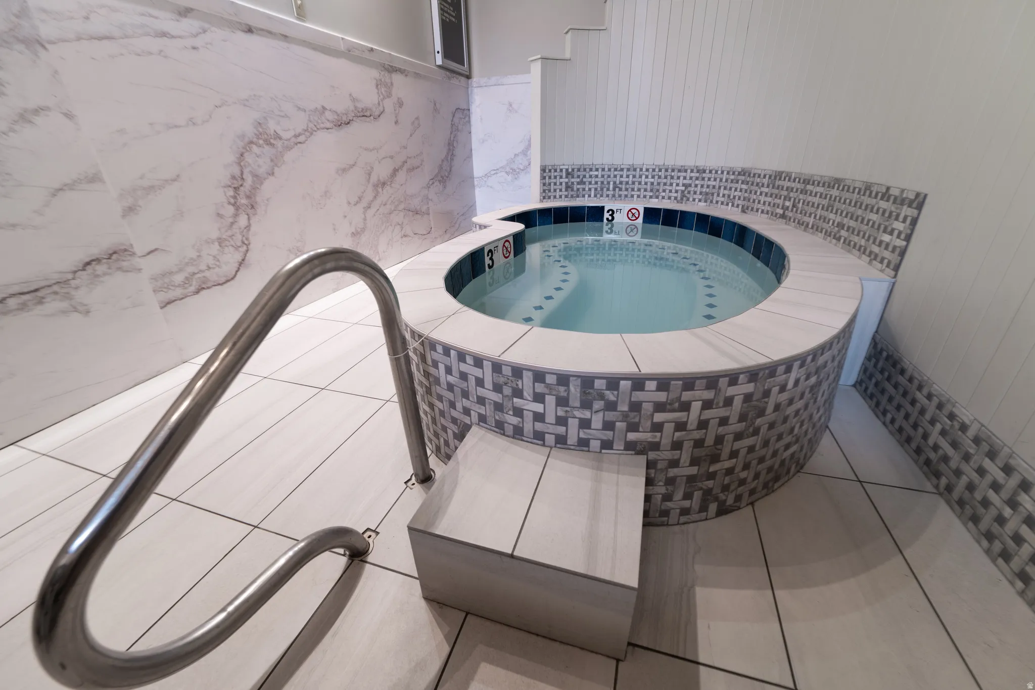 Detailed view of a hot tub and a jetted tub