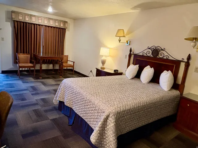 Bedroom featuring dark colored carpet