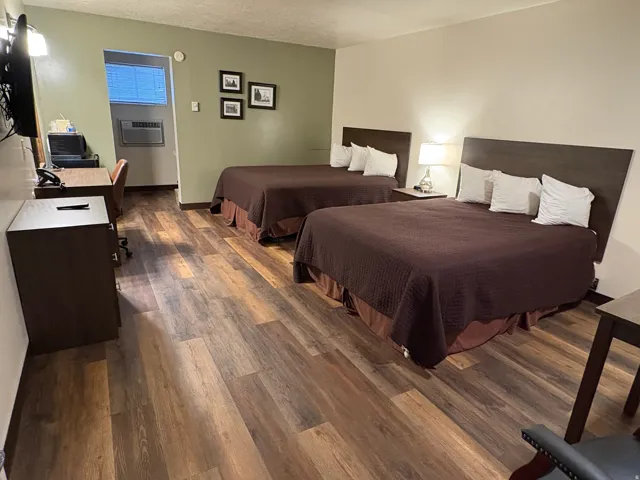 Bedroom featuring dark wood-type flooring and a textured ceiling