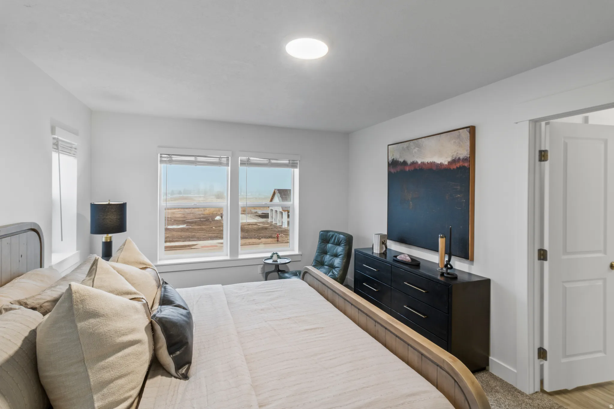 Bedroom with light carpet