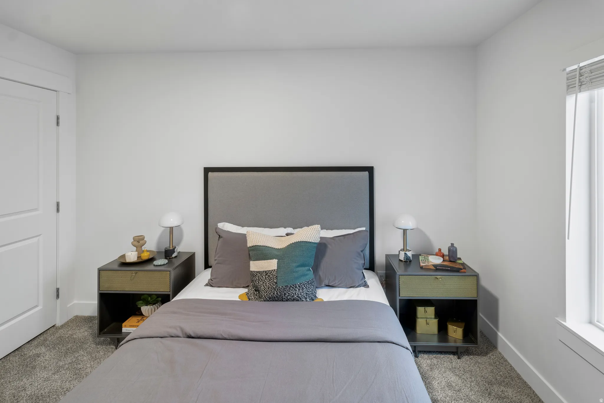 Carpeted bedroom featuring baseboards