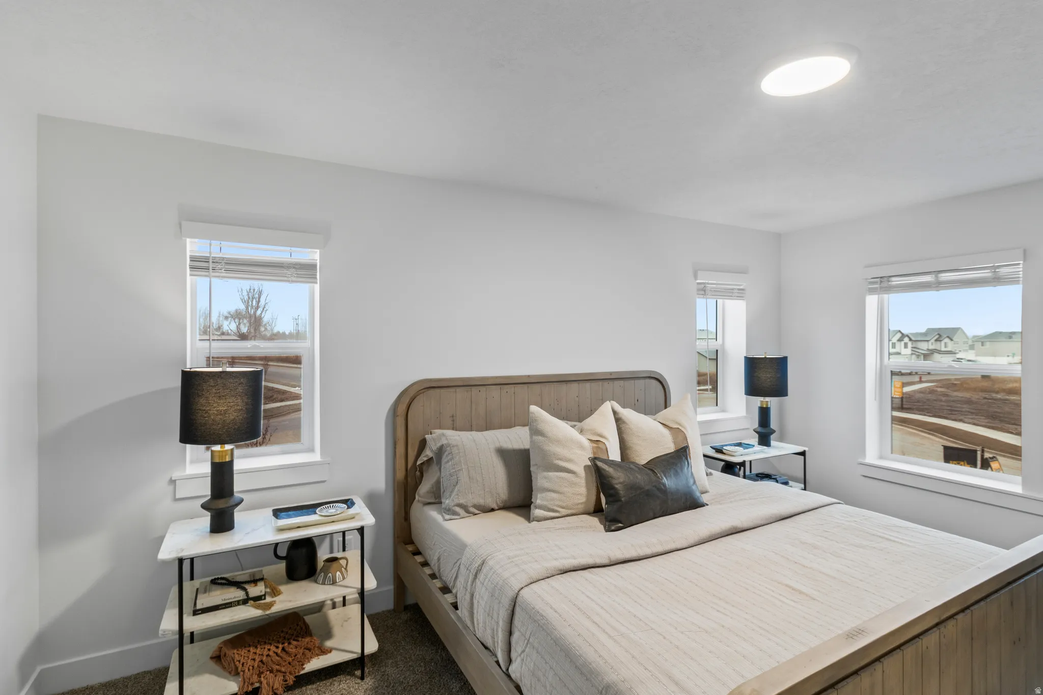 Bedroom featuring baseboards and carpet floors