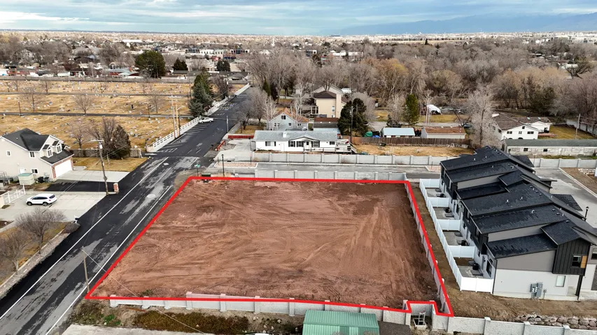 Aerial perspective of suburban area featuring property parcel outlined