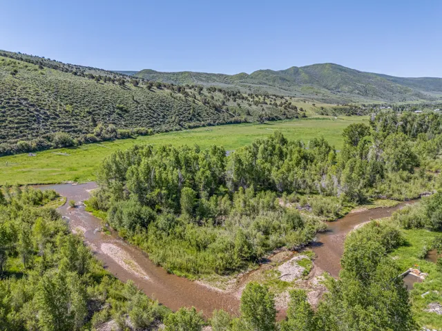 Overview of rural landscape featuring a mountainous background
