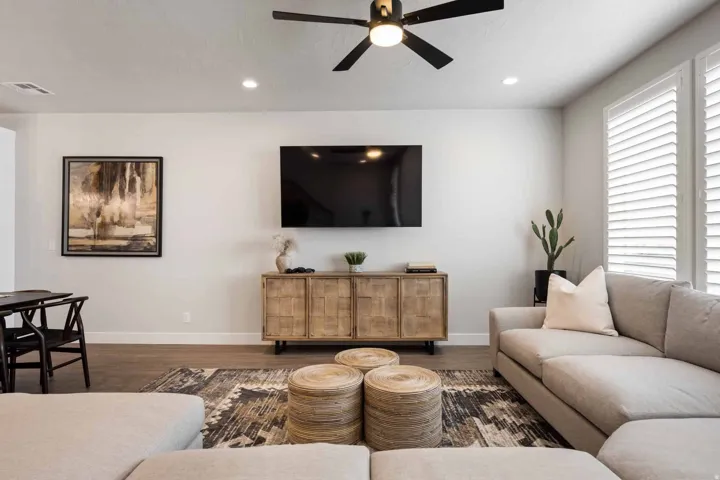 Living room featuring ceiling fan, wood finished floors, and recessed lighting