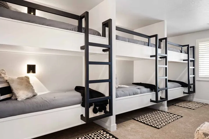 Bedroom featuring carpet floors and baseboards