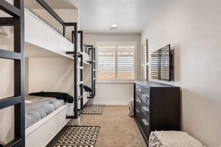Bedroom featuring light colored carpet and recessed lighting