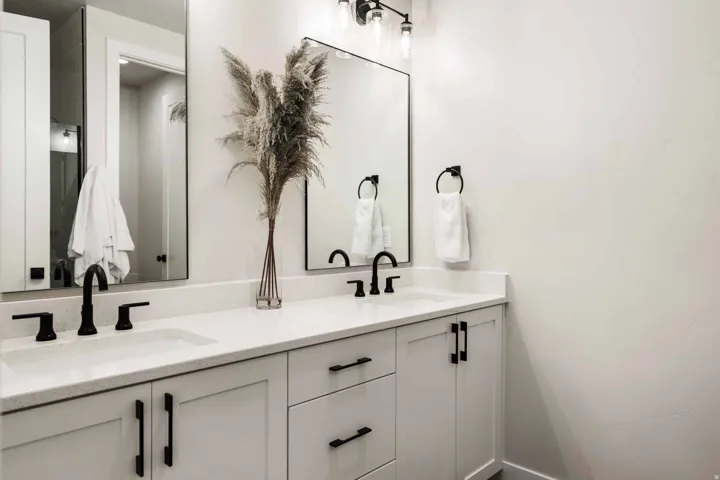 Full bath featuring double vanity