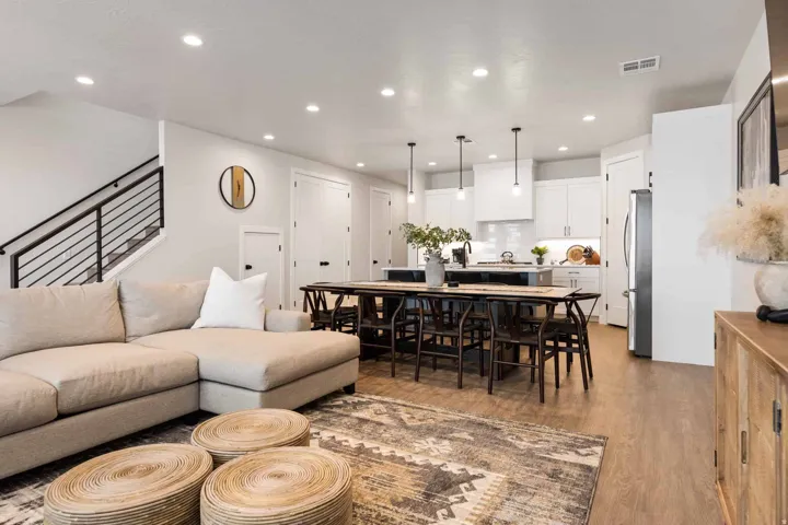 Living area with light wood-style flooring and recessed lighting