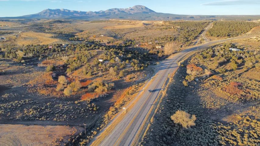 Aerial overview of property's location with a mountainous background