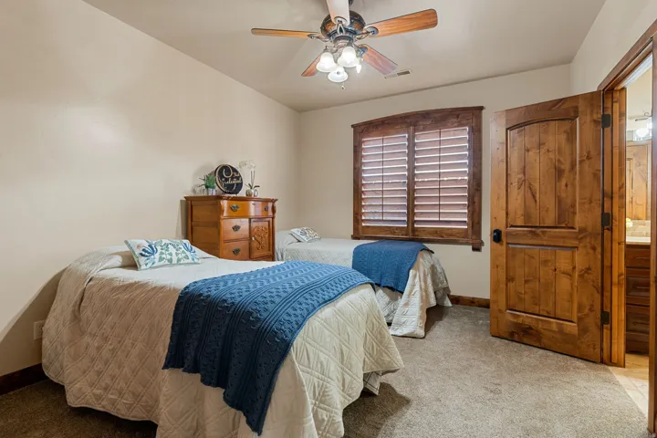 bedroom #2 with a ceiling fan and baseboards