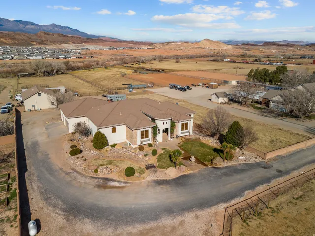 Aerial view of sparsely populated area with a mountainous background