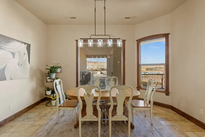 Dining room featuring stone tile floors and plenty of natural light