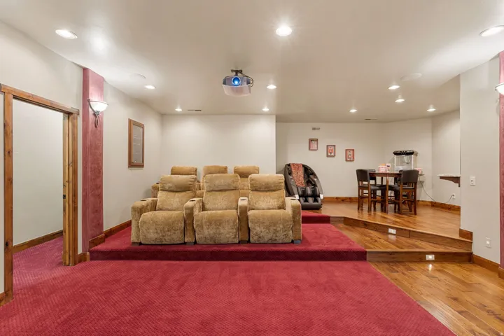 Home theater featuring recessed lighting and hardwood / wood-style floors