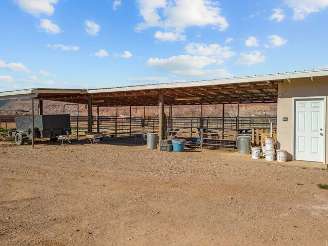 View of yard with an outbuilding and an exterior Corral structure & tack shed.