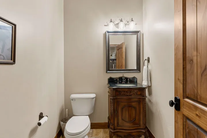 Half bath featuring vanity and toilet