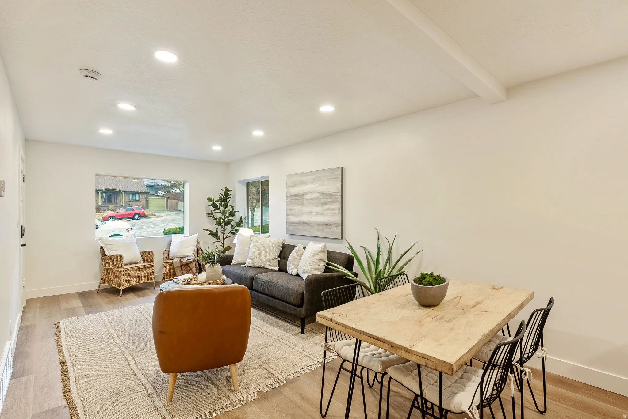 Living area featuring light wood-type flooring and recessed lighting
