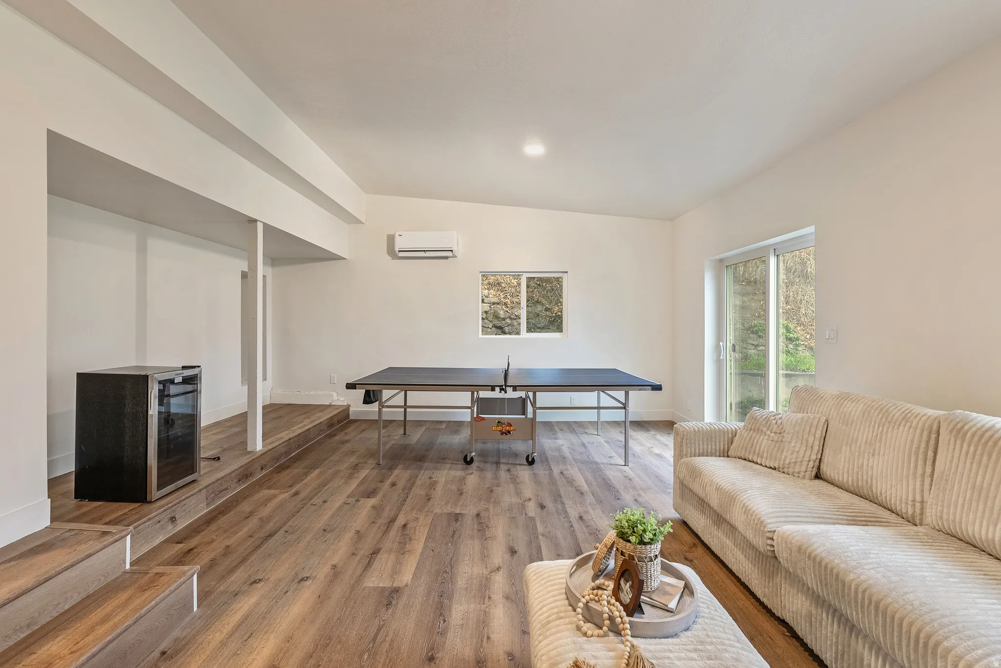 Living area featuring wood finished floors and wine cooler