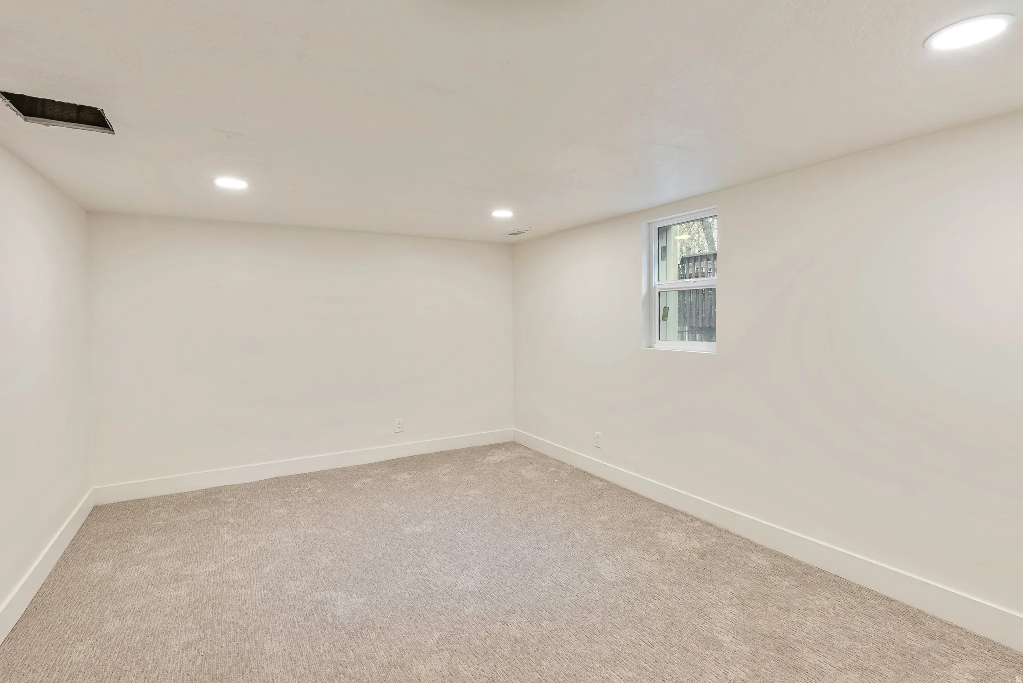 Basement featuring recessed lighting and carpet floors