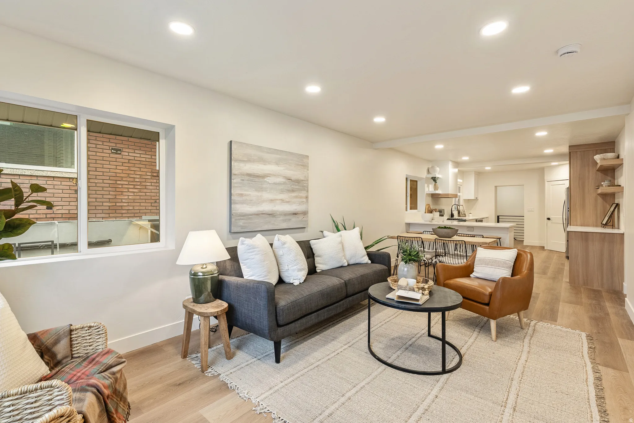 Living room featuring light wood finished floors and recessed lighting