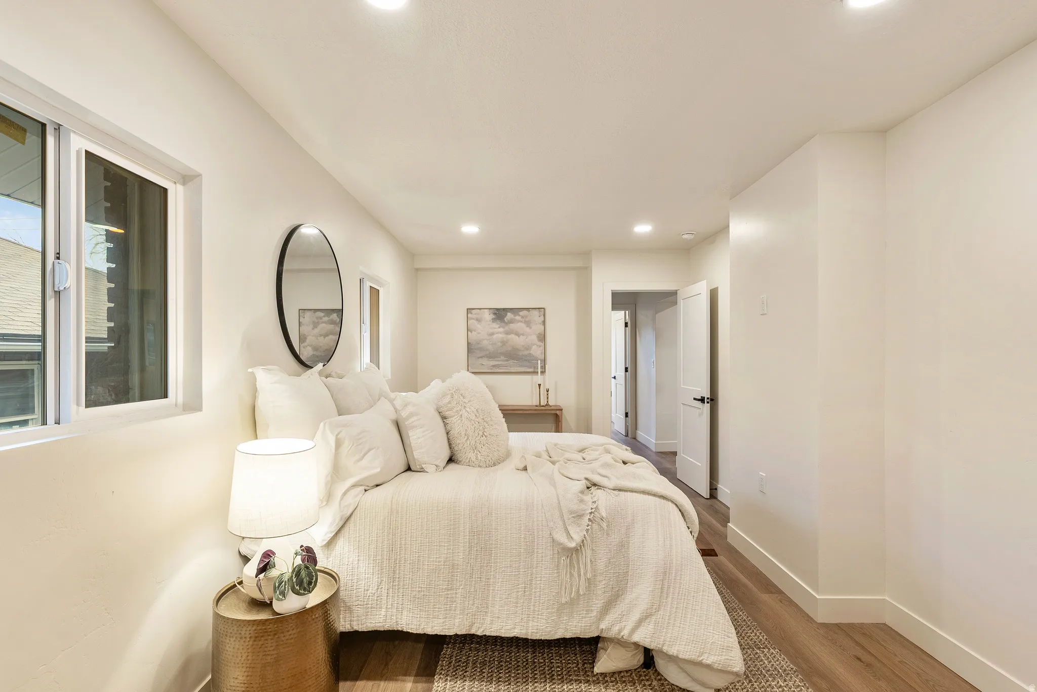 Bedroom with wood finished floors and recessed lighting