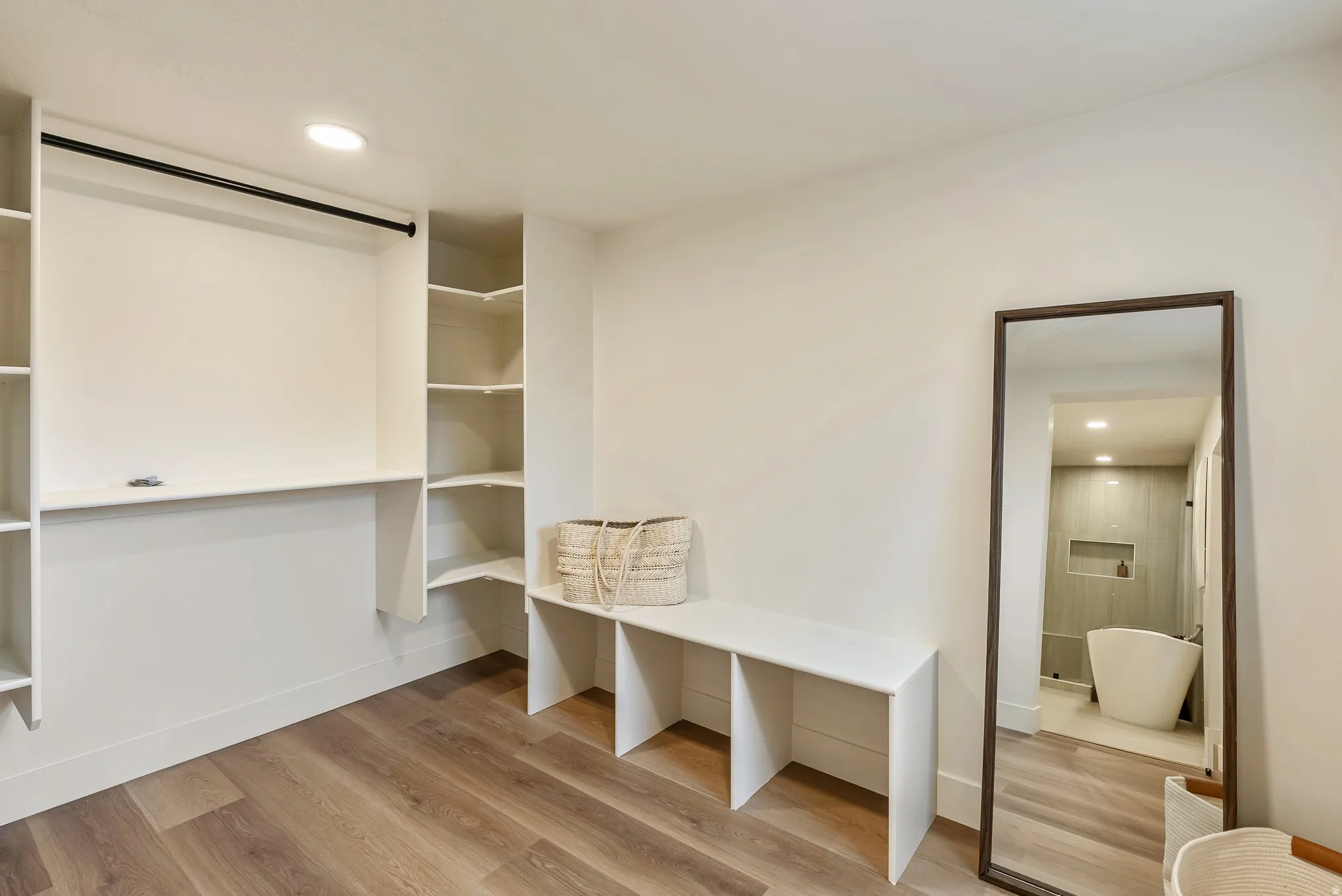 Mudroom with recessed lighting and light wood-style flooring