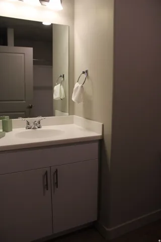 Bathroom featuring vanity and baseboards