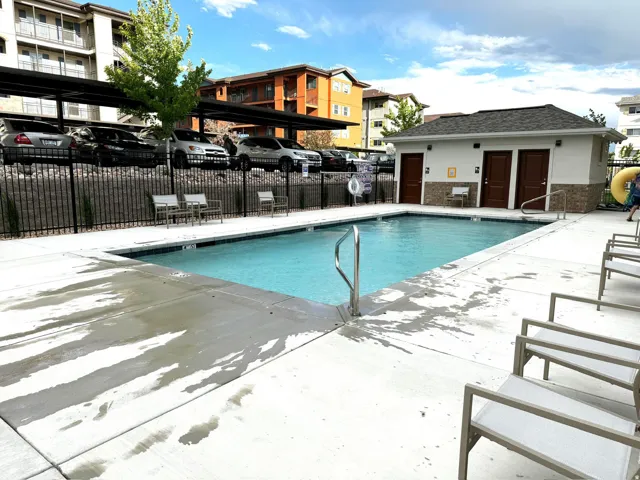 Community pool with a patio area