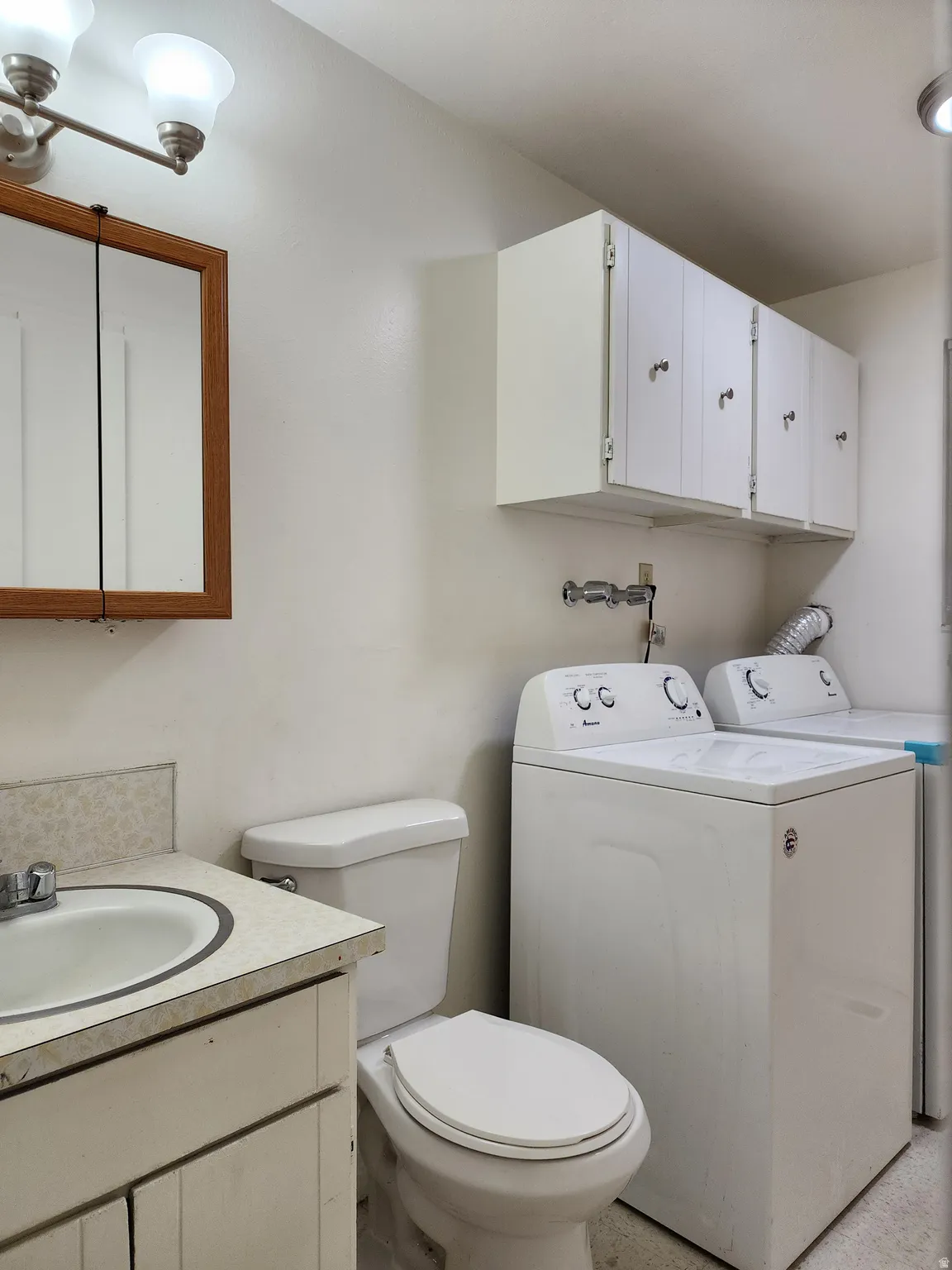 Bathroom with washer/dryer hookups