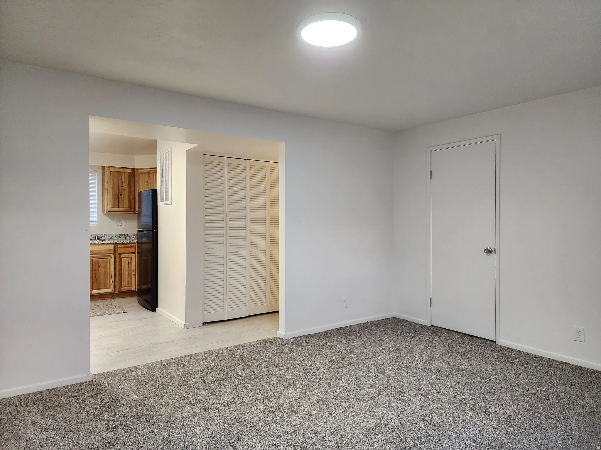 Living room with light carpet
