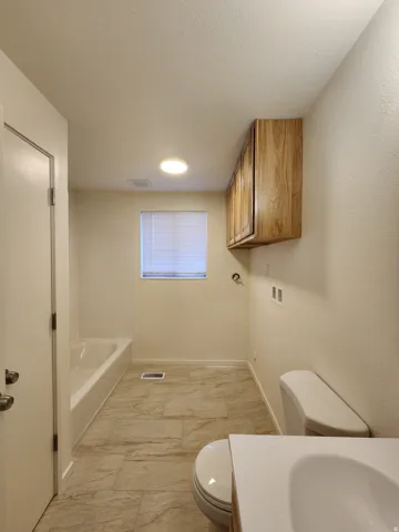 Full bath with washer and dryer hookups.