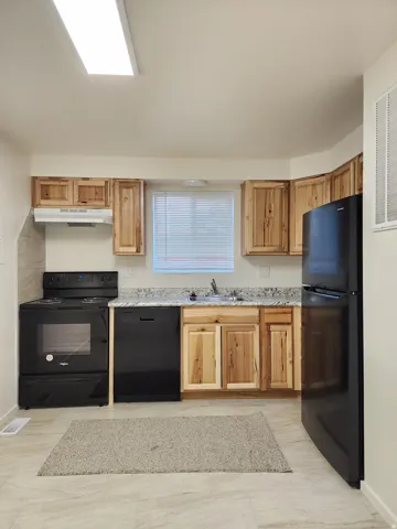Upgraded kitchen with granite/stone counters