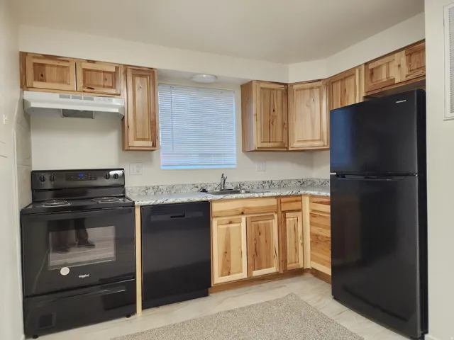 Kitchen featuring new appliances and new cabinetry
