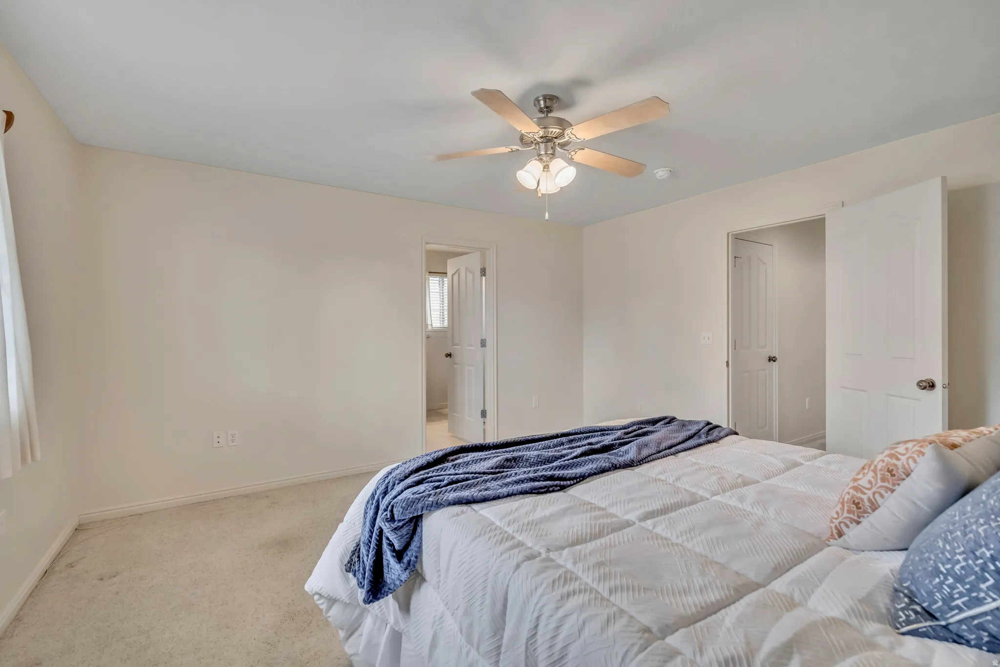 Bedroom featuring carpet floors and ceiling fan