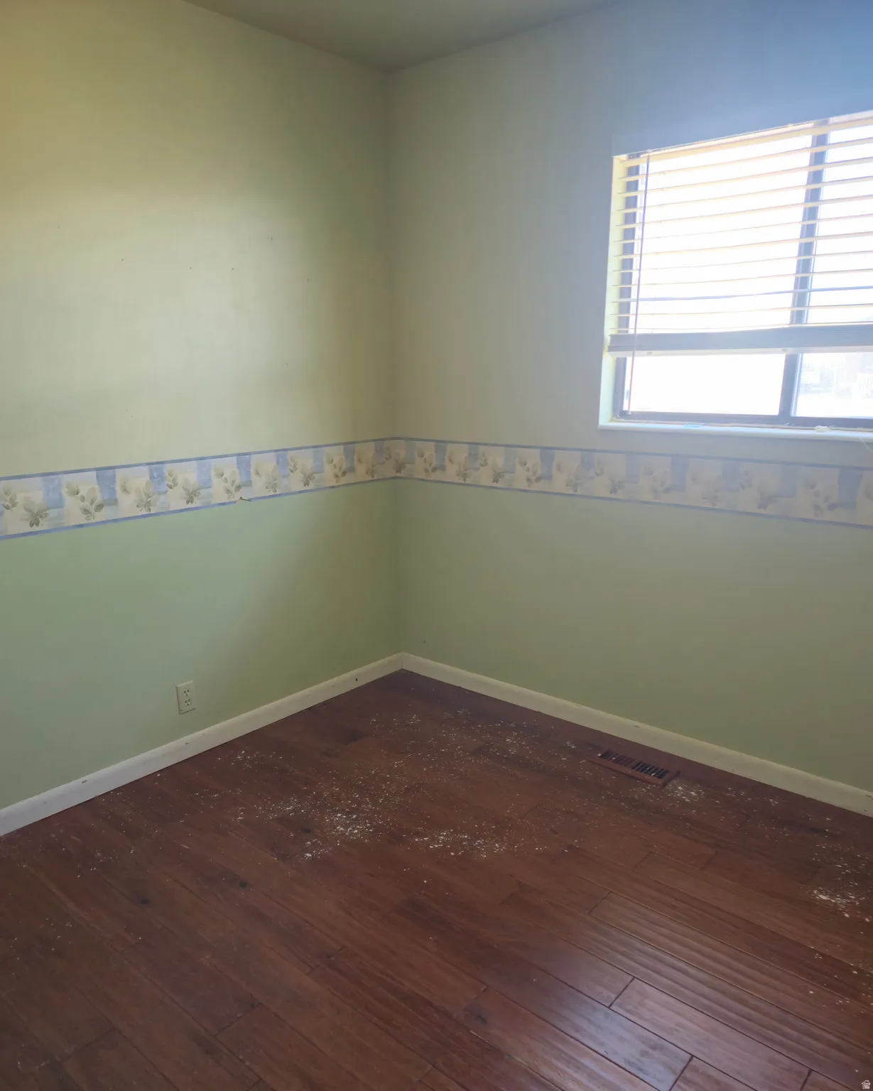 Empty room with dark wood-style floors