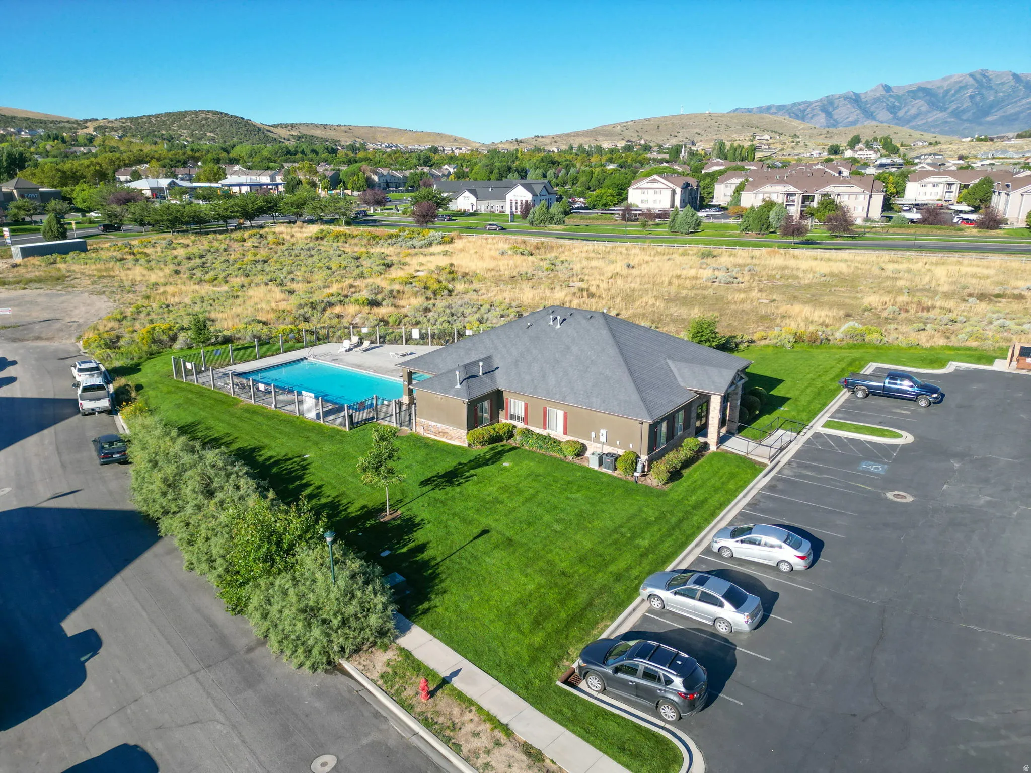 Aerial perspective of suburban area featuring a mountainous background