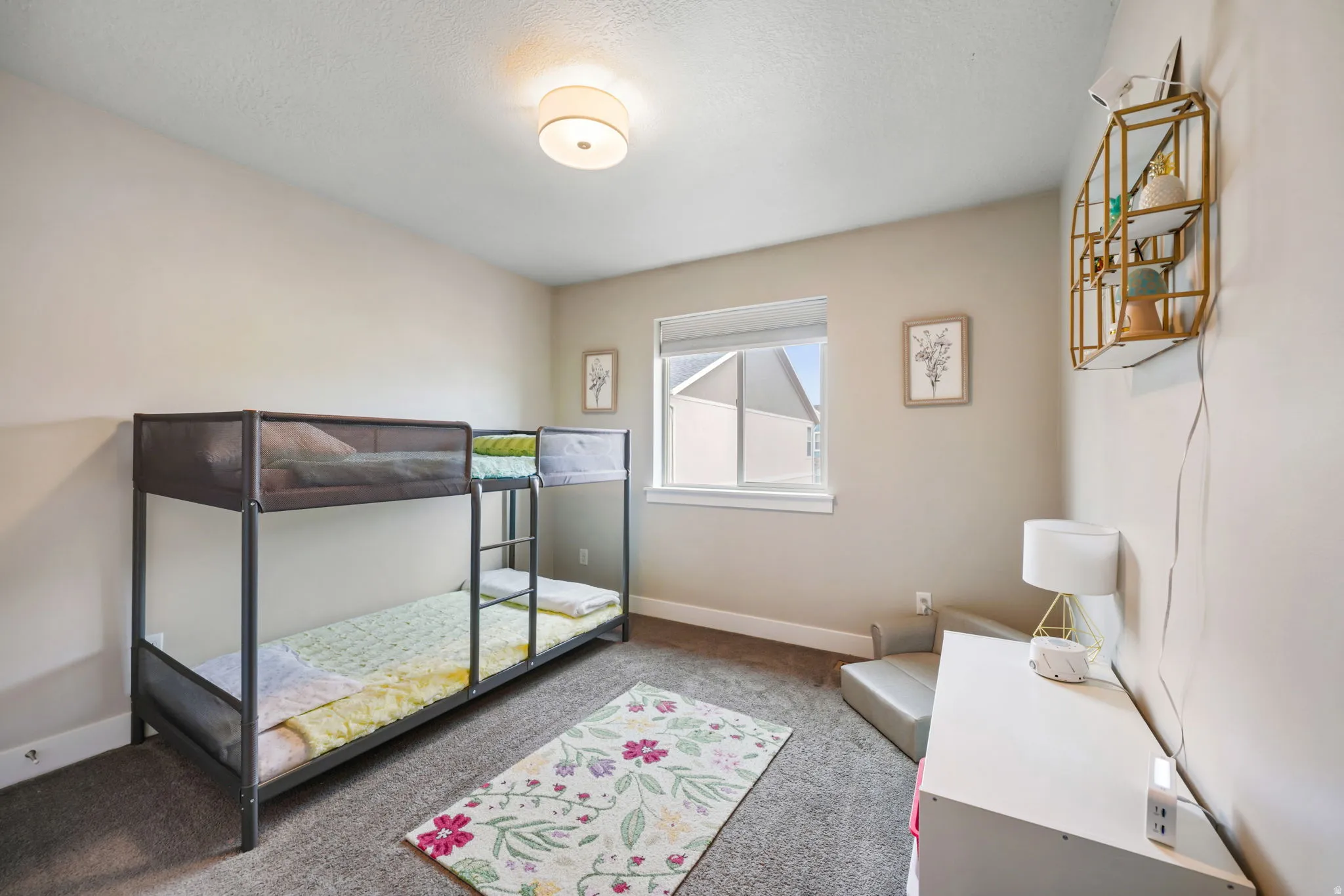 Carpeted bedroom with baseboards
