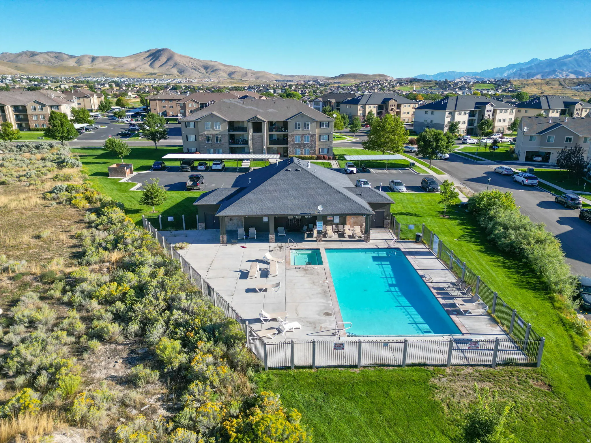 Aerial perspective of suburban area featuring a mountain backdrop